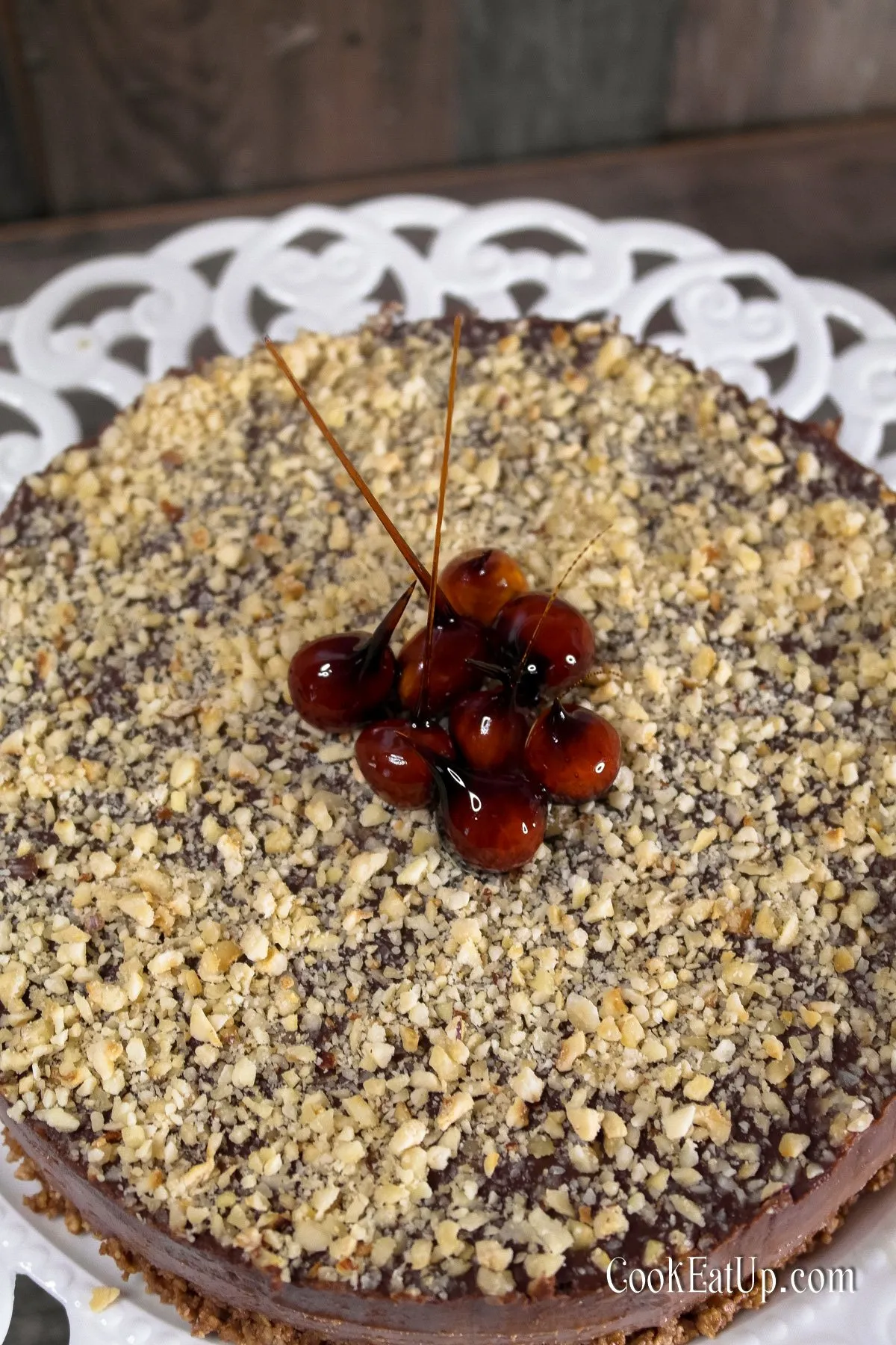 Chocolate Glazed Praline Cheesecake with Candied Hazelnuts