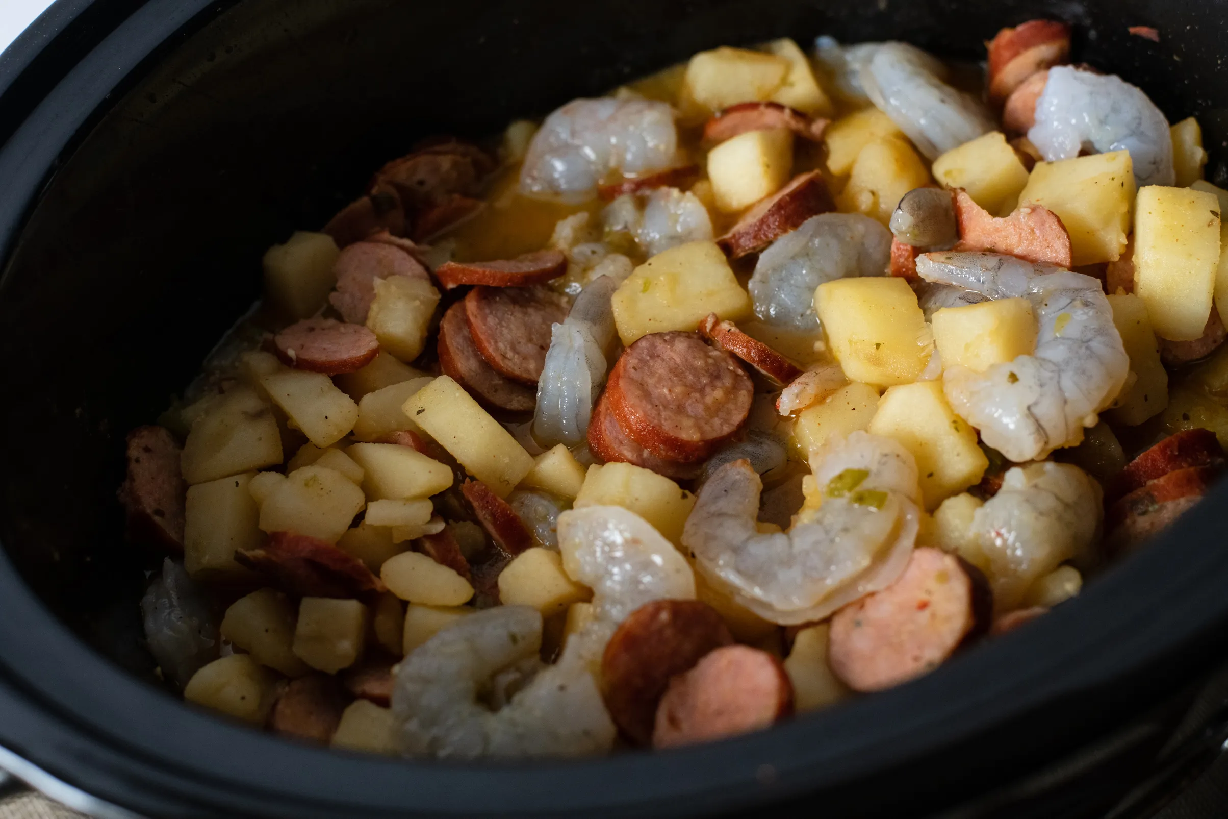 Crockpot Cajun Smothered Potatoes with Sausage and Shrimp