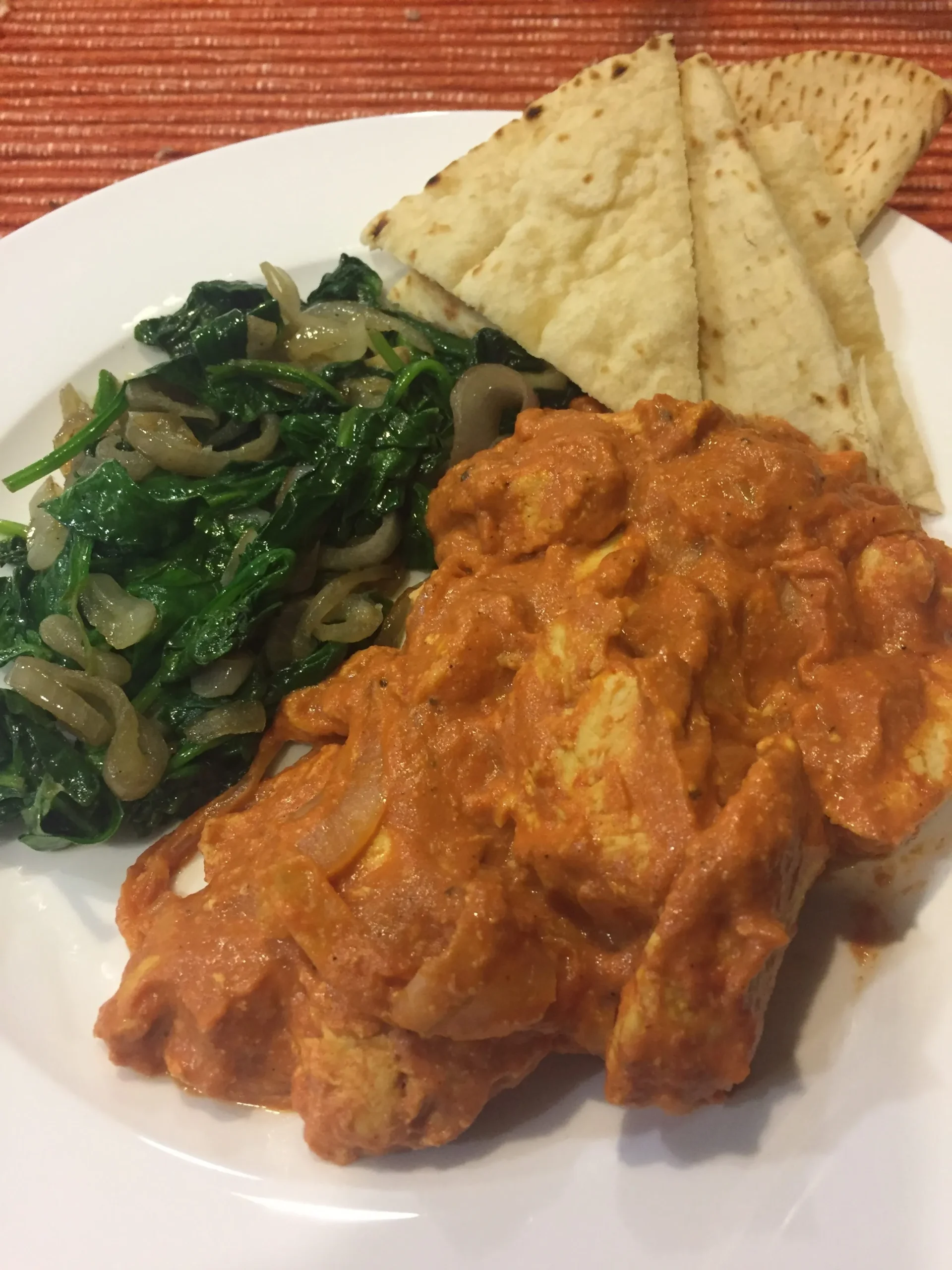 Indian Butter Chicken with Sautéed Spinach and Toasted Naan