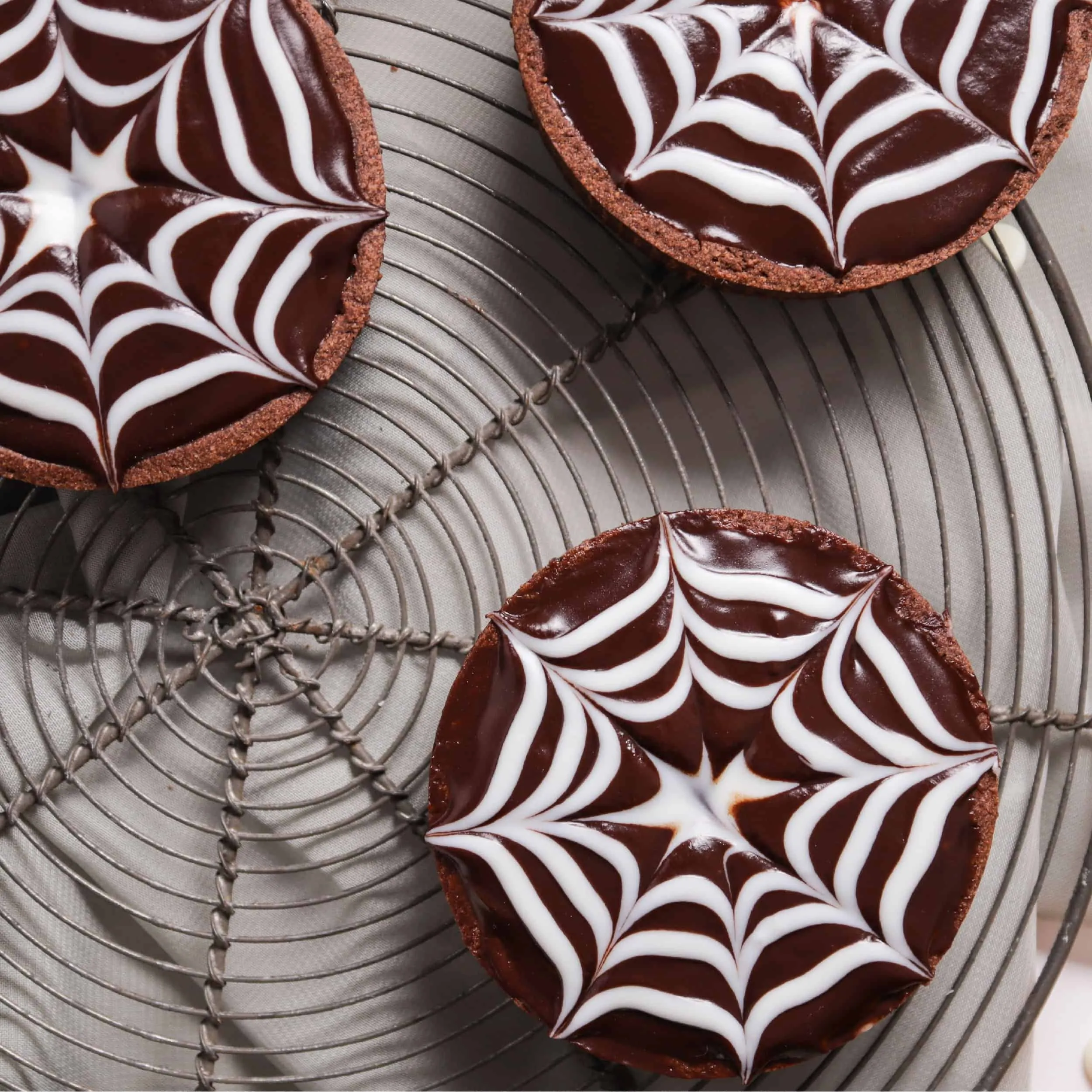 Mini Chocolate Ganache Spiderweb Tarts