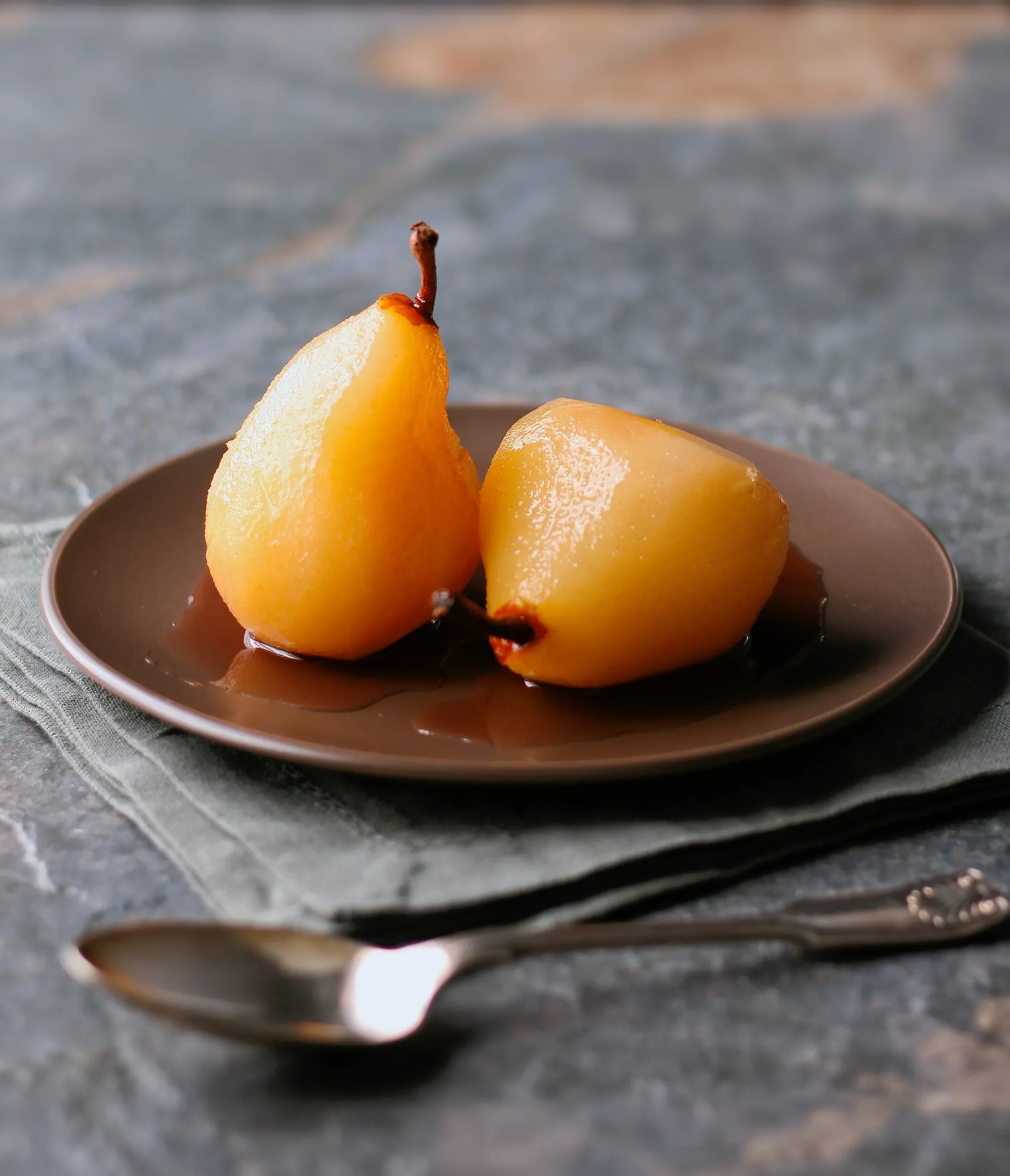 Pears Poached in Rosemary with Chocolate Sauce
