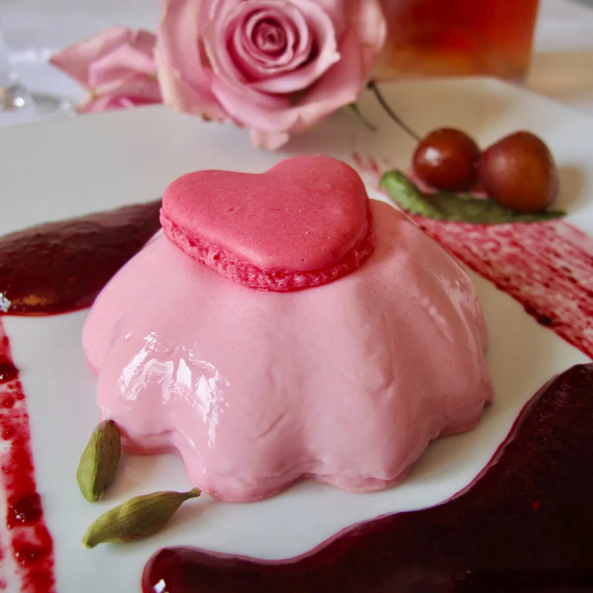 Rose White Chocolate Panna Cotta with Cherry Cardamom Coulis