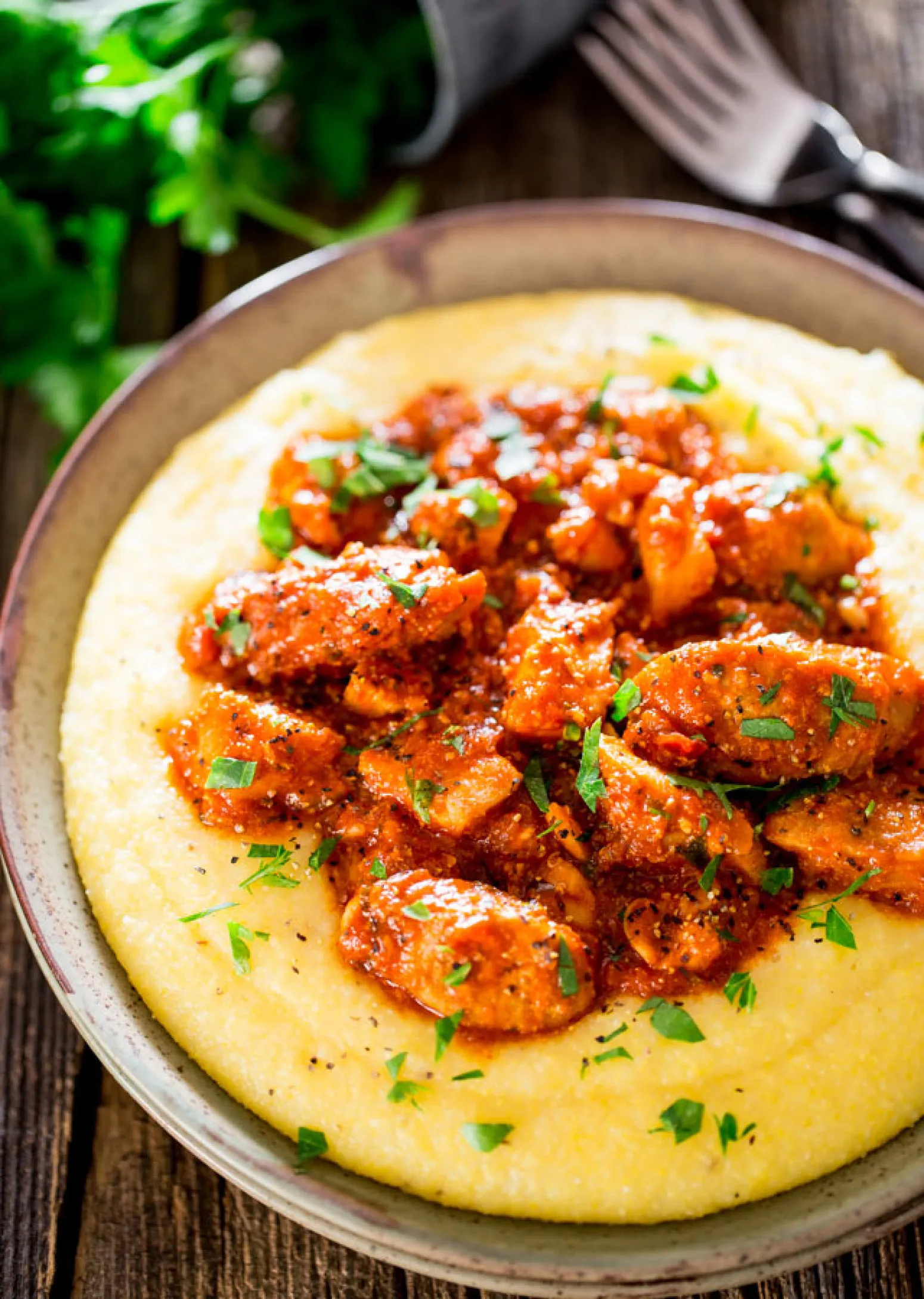 Saucy Chicken and Sausage over Creamy Parmesan Polenta