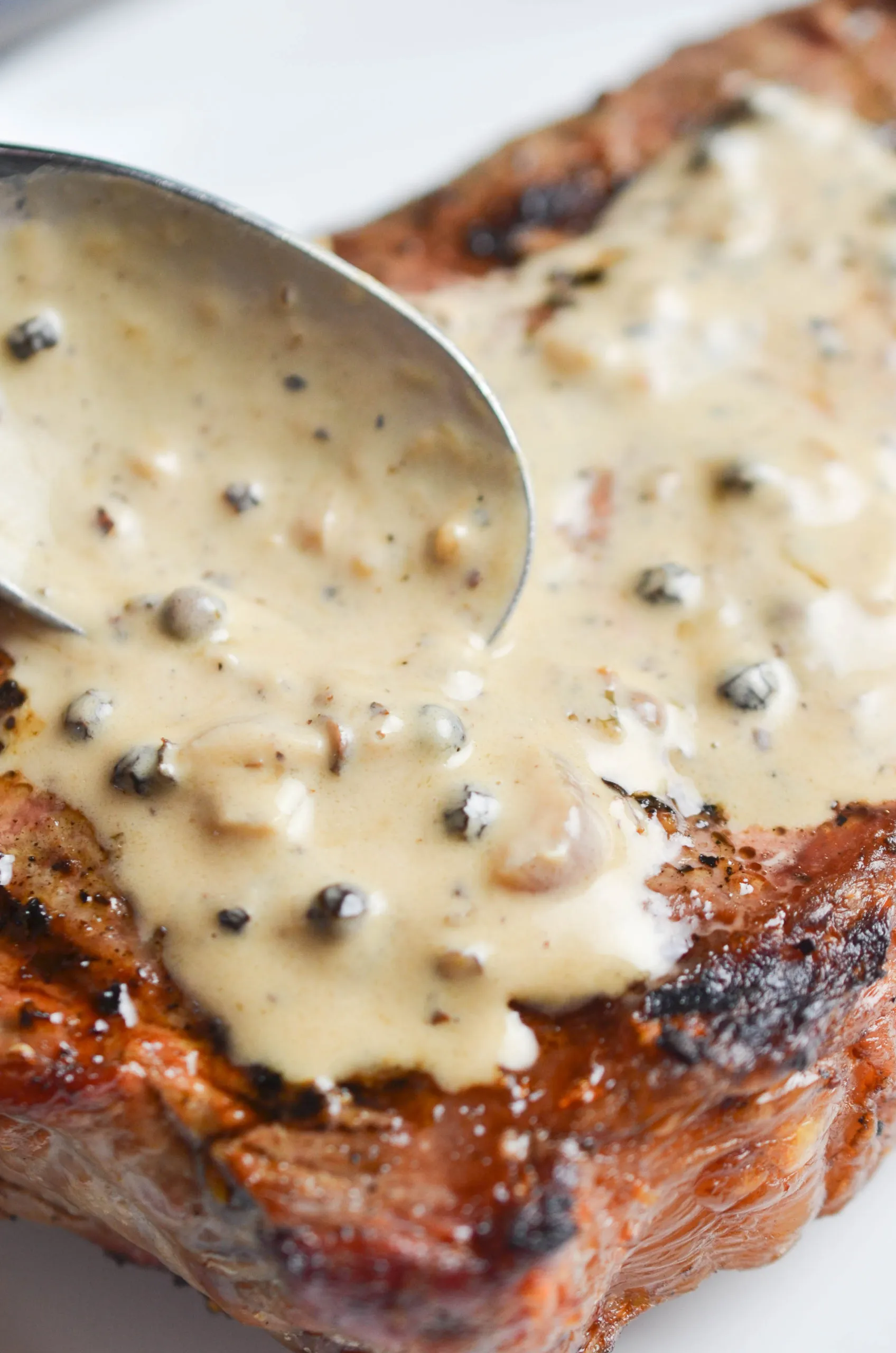 Steak with Peppercorn Cream Sauce